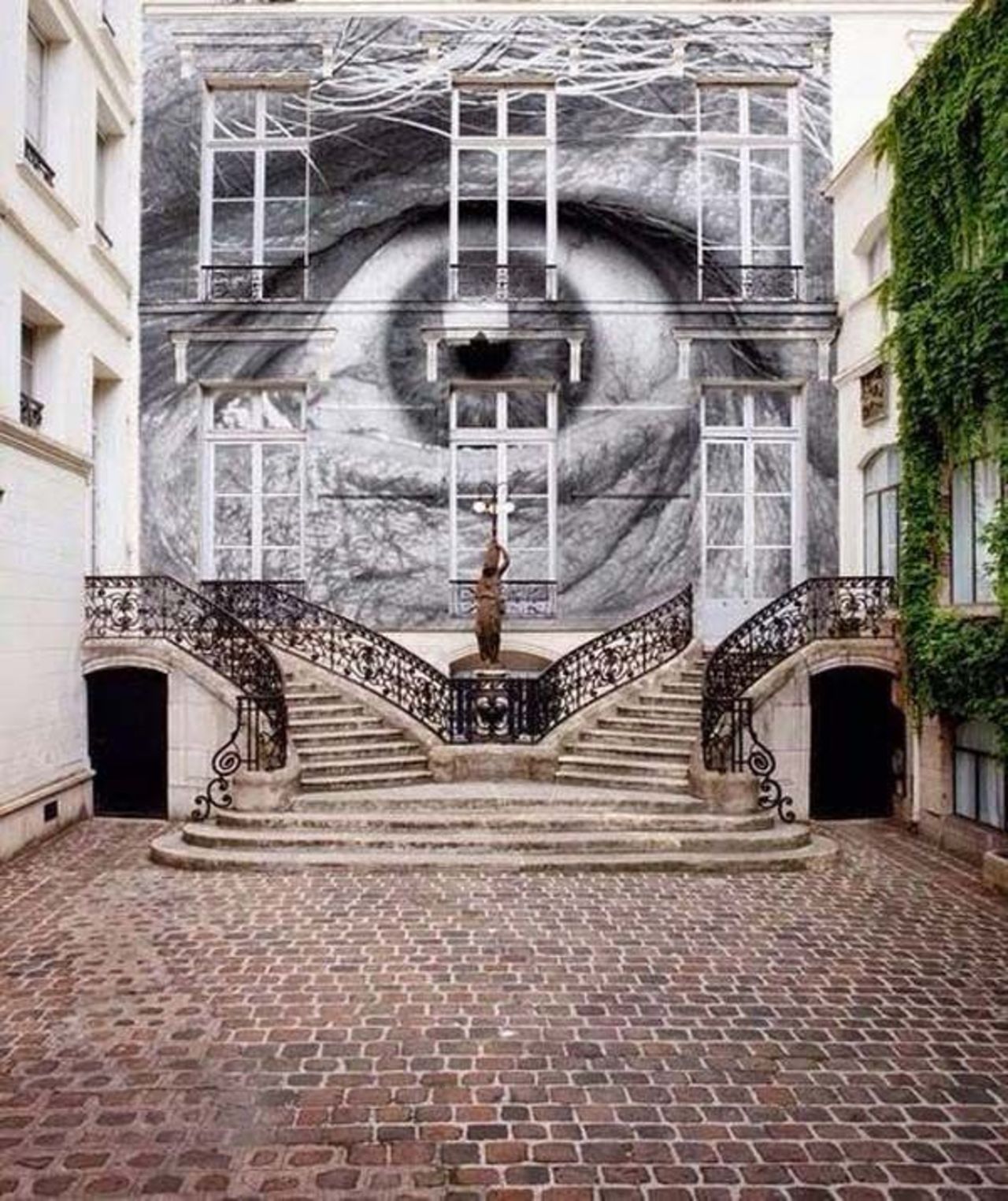Mural in Paris, France by JR #streetart #mural #graffiti #art https://t.co/EFgCbsnQVR