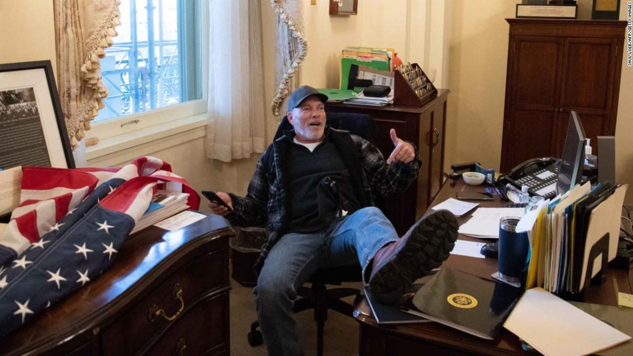 Man who put his feet on desk in Pelosi's office to be released from jail pending trial