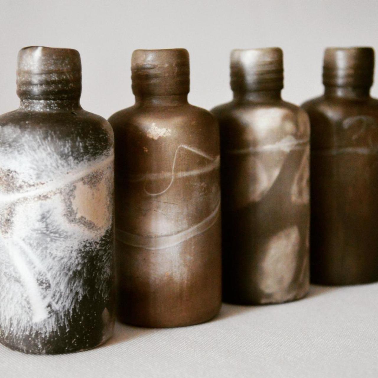 Limited edition smoke fired bottles. #ceramics #porcelain #smokefire #display http://t.co/8yRv9kNj93